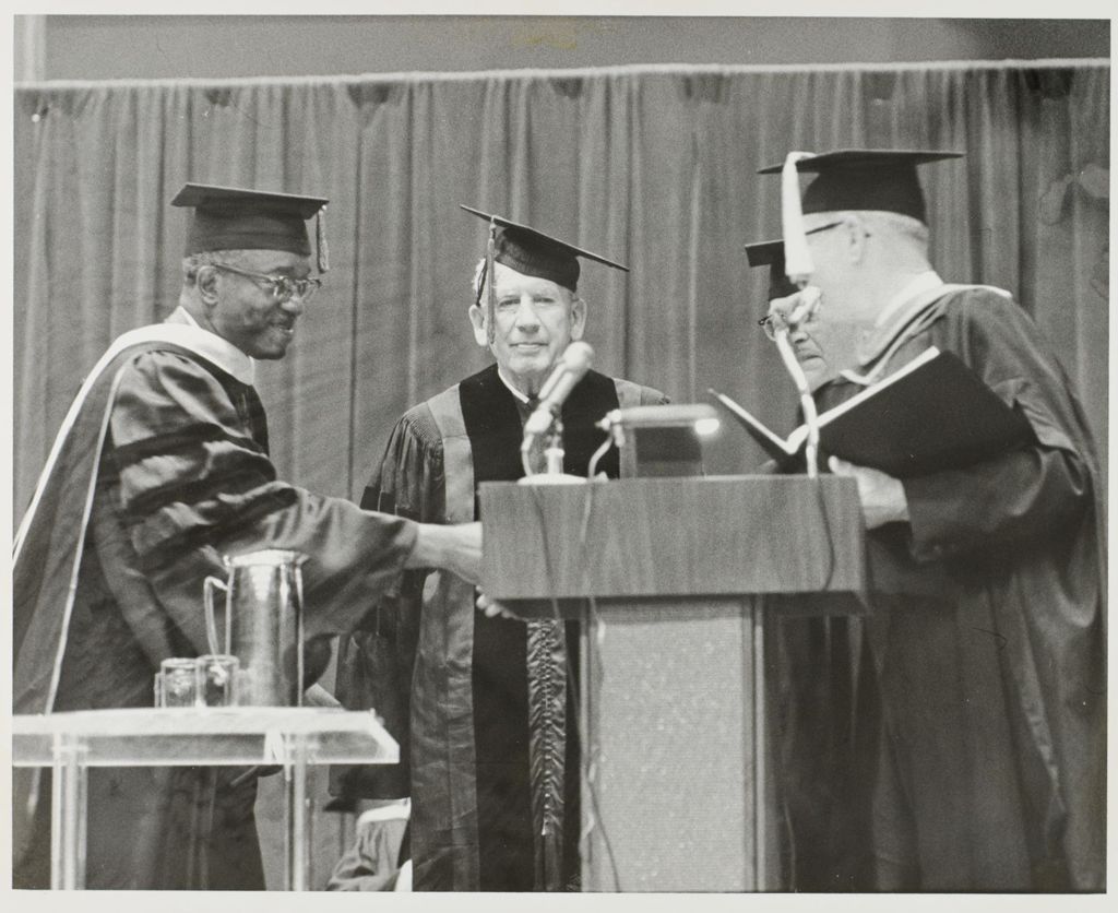 John Hope Franklin, Paul Douglas, University of Illinois President David Dodds Henry, and Chancellor Norman Parker at a graduation ceremony (from left to right).