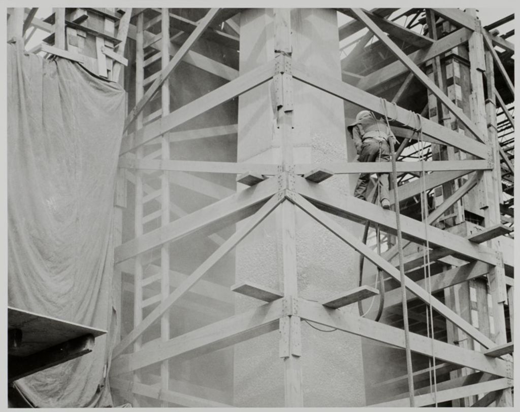 Miniature of Close-up of scaffolding and worker on a building under construction