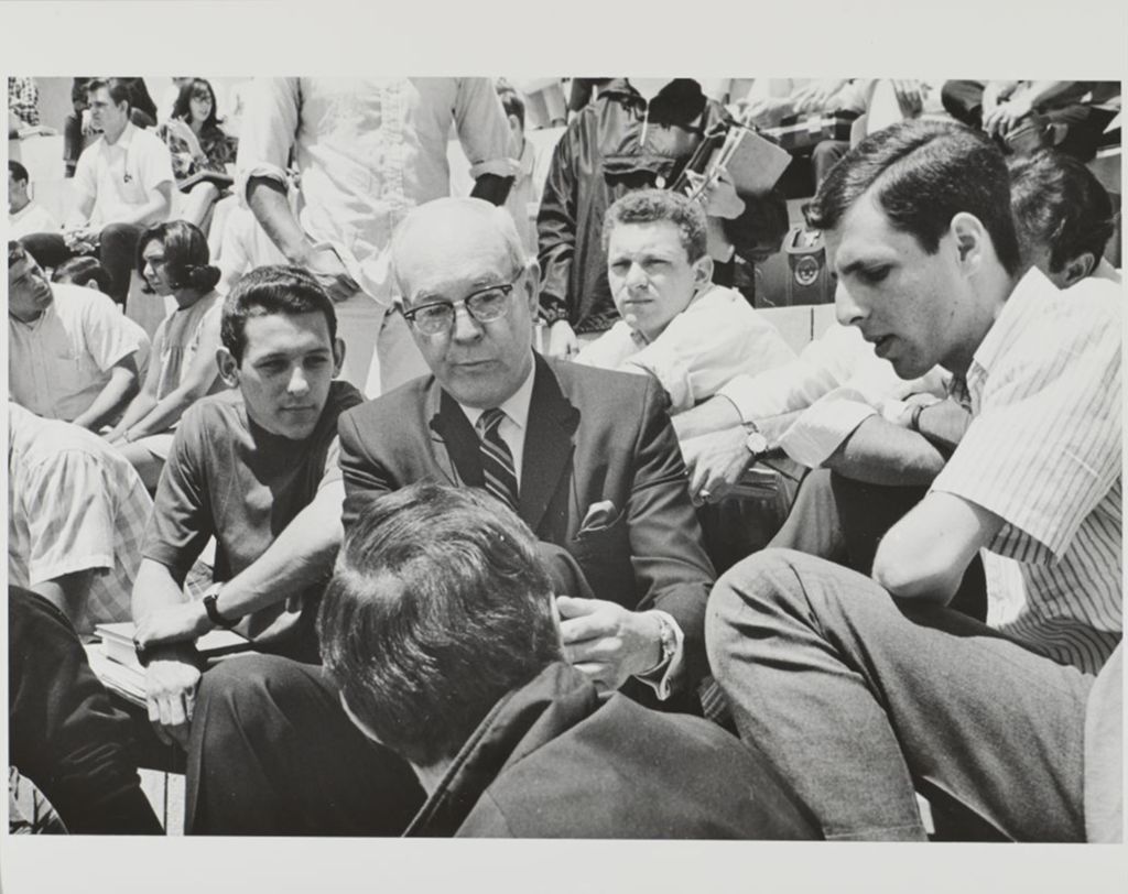 Miniature of Chancellor Norman Parker speaking with students in the Great Court/Forum