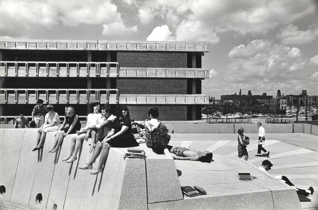 Students in the Forum with the Richard J. Daley Library in the background
