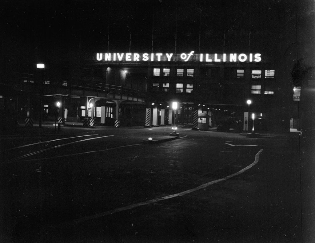 Illuminated sign at night, University of Illinois Chicago Undergraduate Division