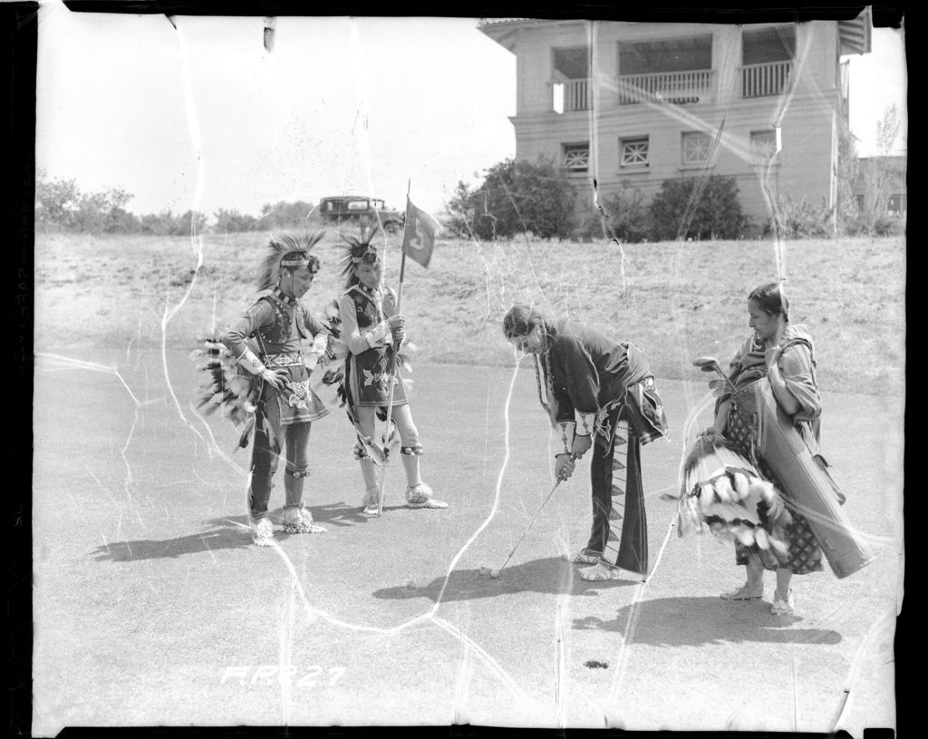 Miniature of Native American re-enactors playing golf