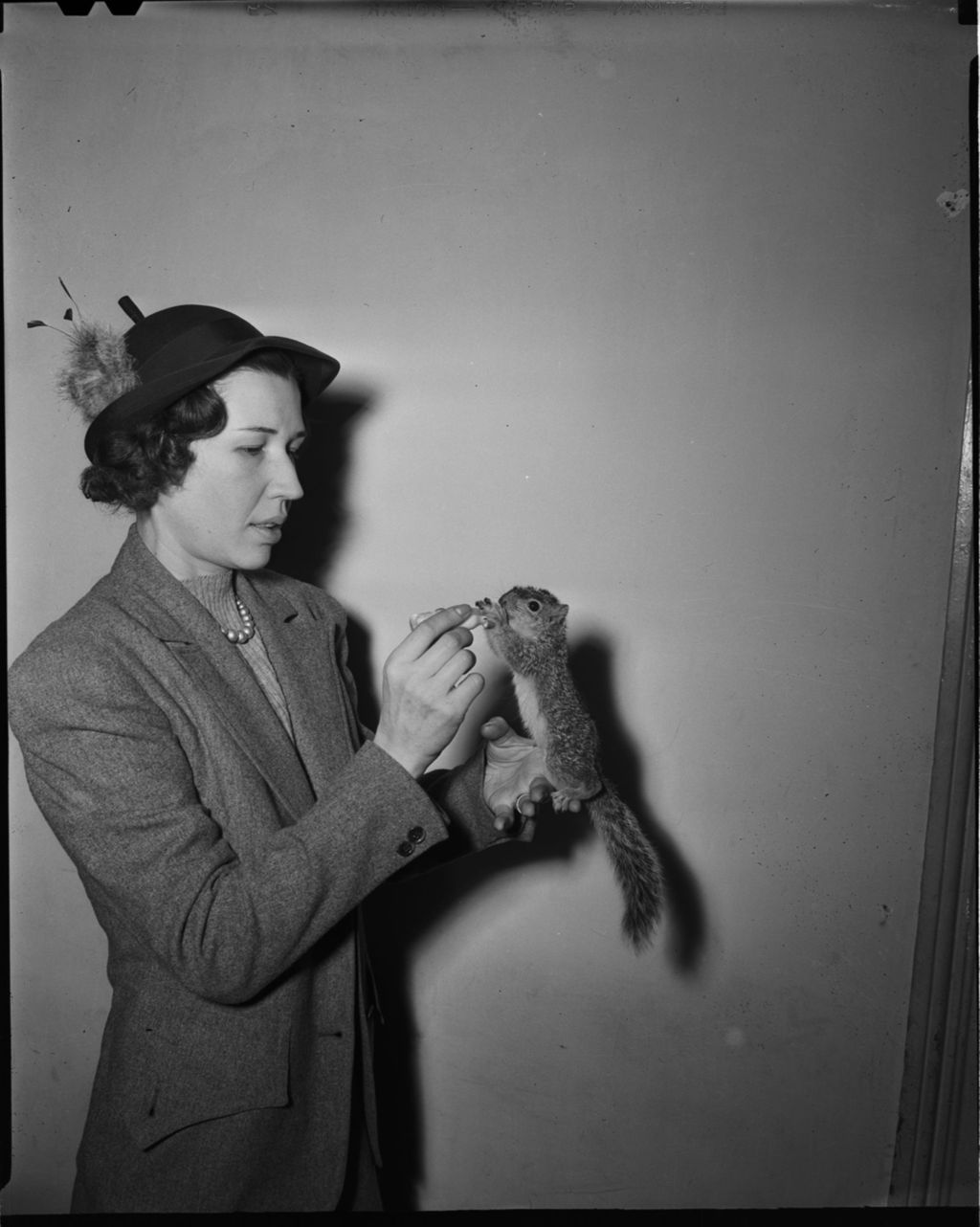 Miniature of Woman feeding Squirrel
