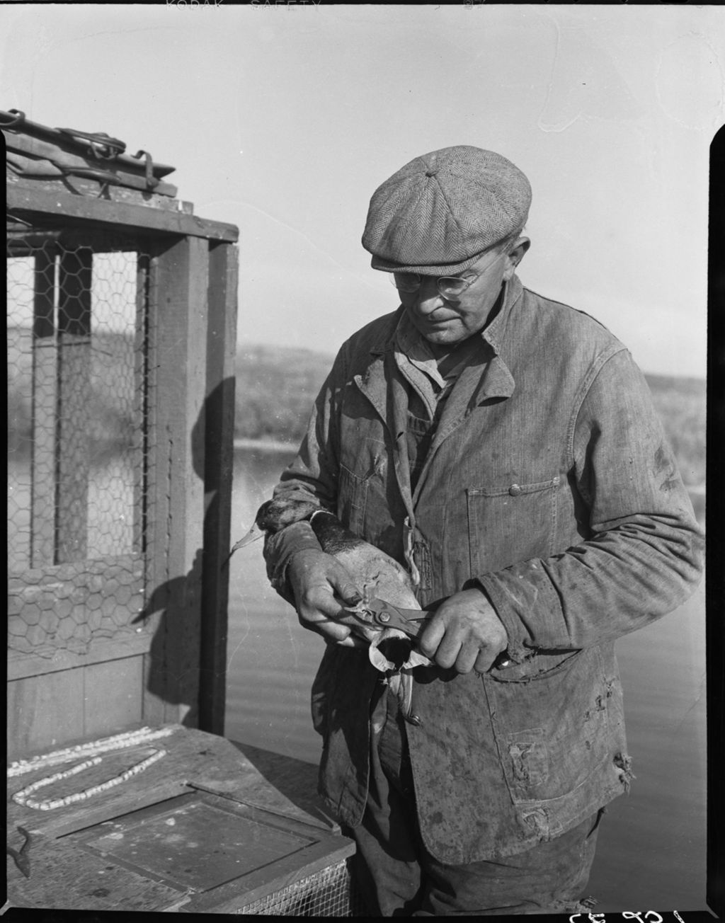 Miniature of Man holding waterfowl
