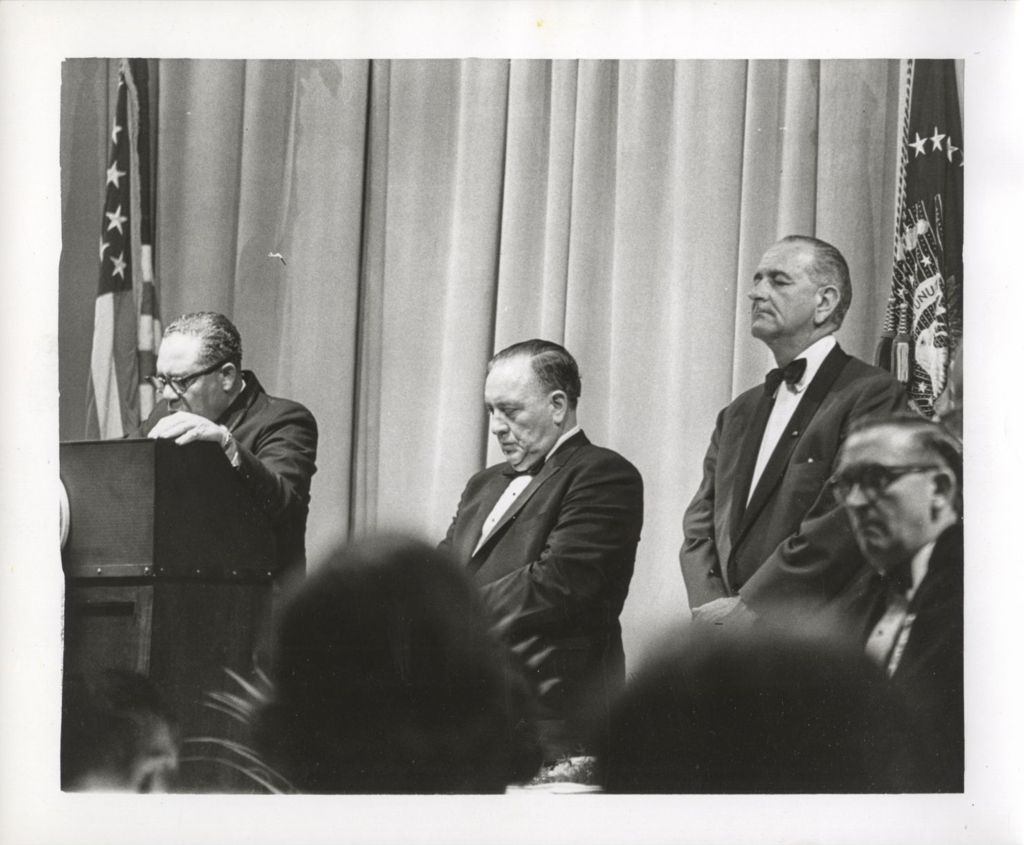 Lyndon B. Johnson and Richard J. Daley listening to a speaker