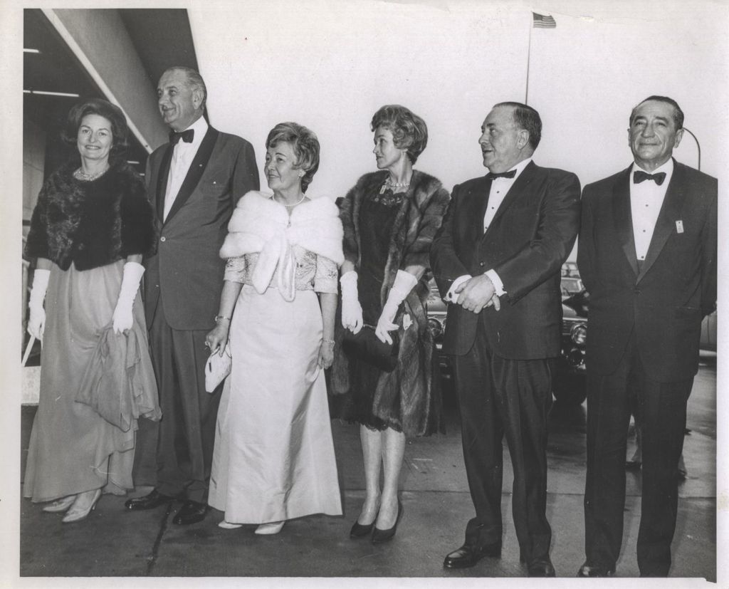 The Johnsons and the Daleys dressed in formal attire