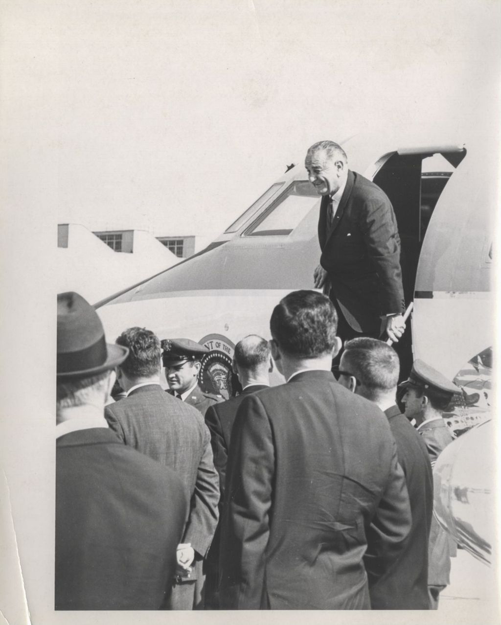 Miniature of Lyndon B. Johnson stepping off the presidential plane