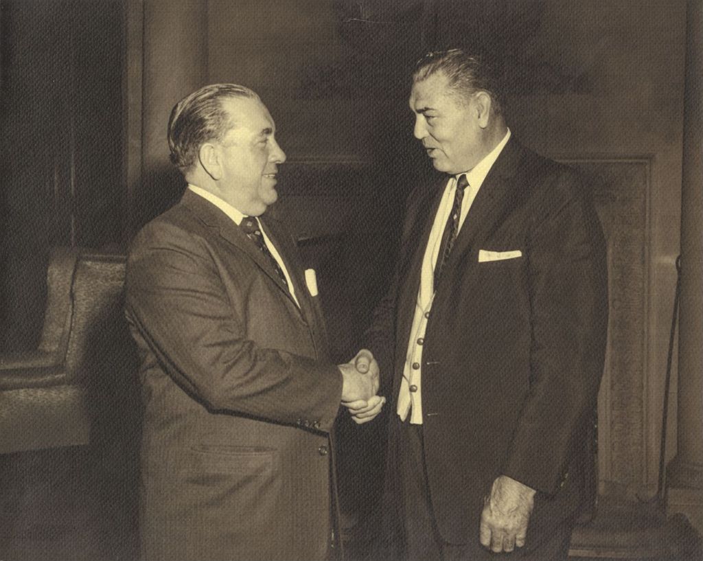 Richard J. Daley shaking hands with boxer Jack Dempsey