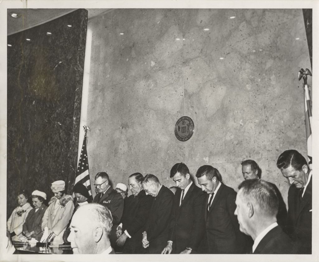 Richard J. Daley, John Young and Gus Grissom, Otto Kerner, and others with heads bowed