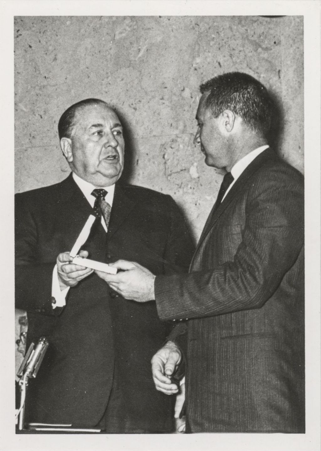 Astronaut Gus Grissom accepts an award from Richard J. Daley