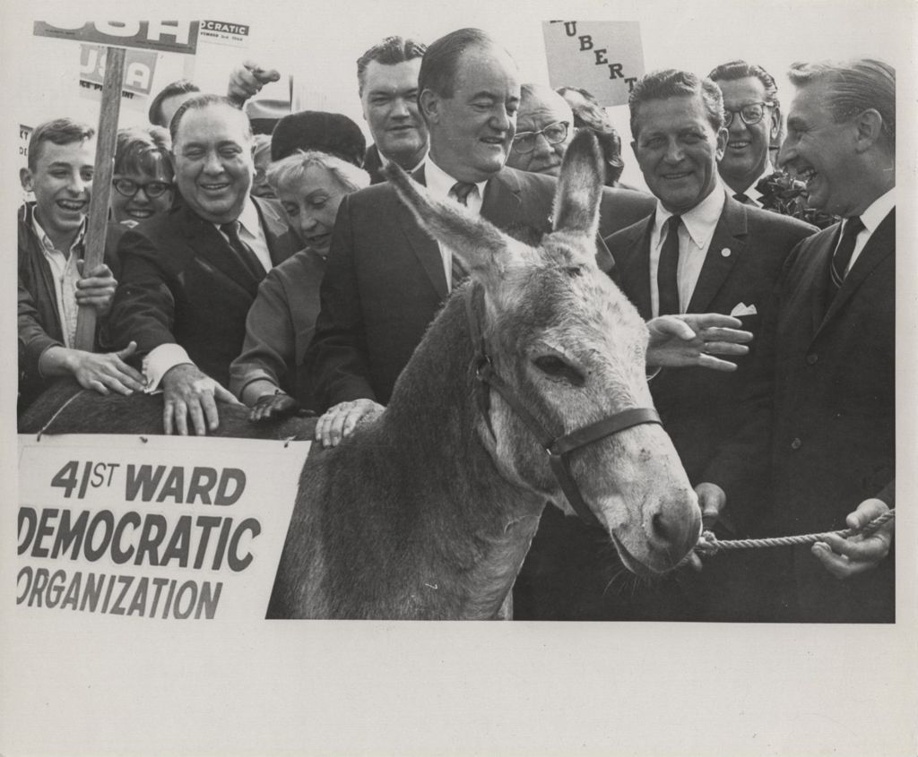 Hubert and Muriel Humphrey, Richard J. Daley, Otto Kerner and others with a Democratic donkey