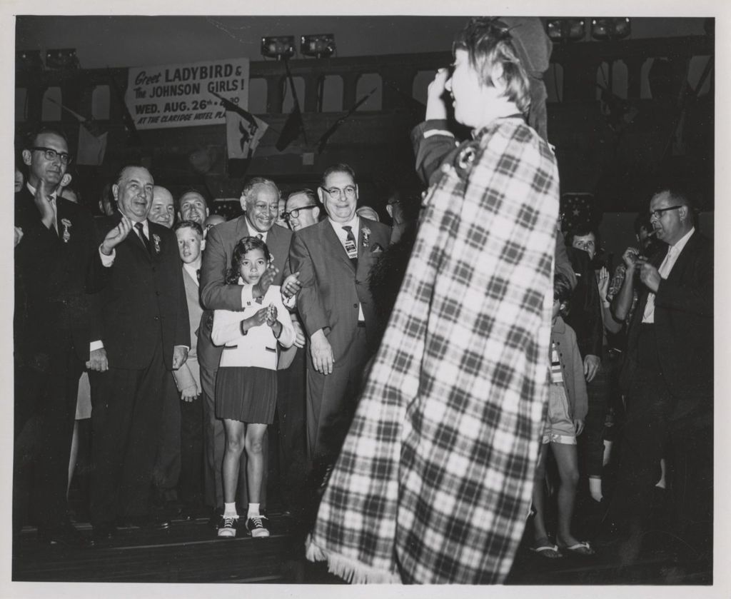 Richard J. Daley and others watching a girl performing