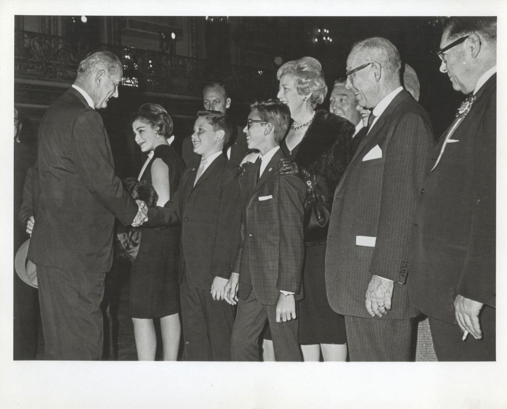 Miniature of Lyndon B. Johnson greeting guests at a reception