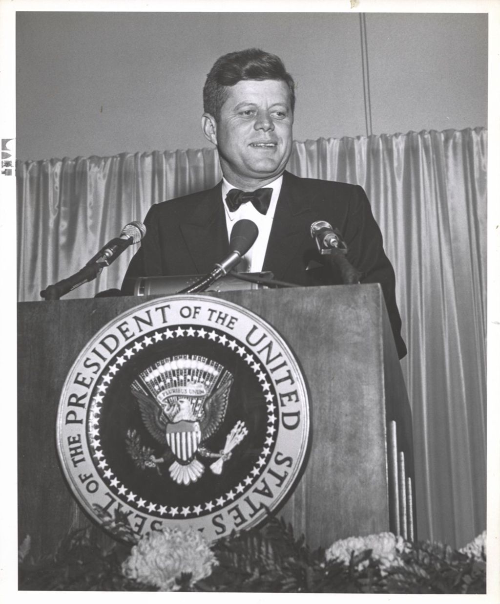John F. Kennedy at the speaker's podium at Democratic fundraising dinner