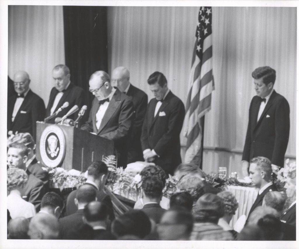 Miniature of John F. Kennedy listens to opening prayer at Democratic fundraising dinner