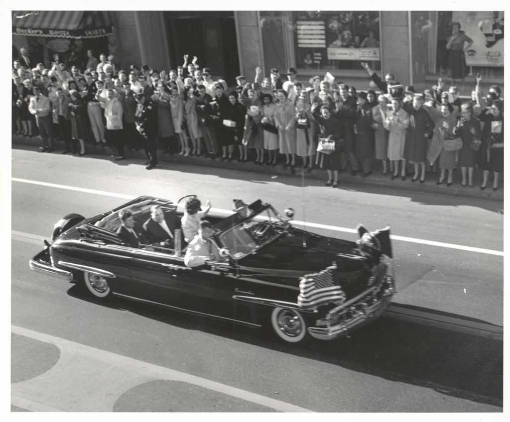 Eunice Kennedy Shriver waving to crowd from President Kennedy motorcade