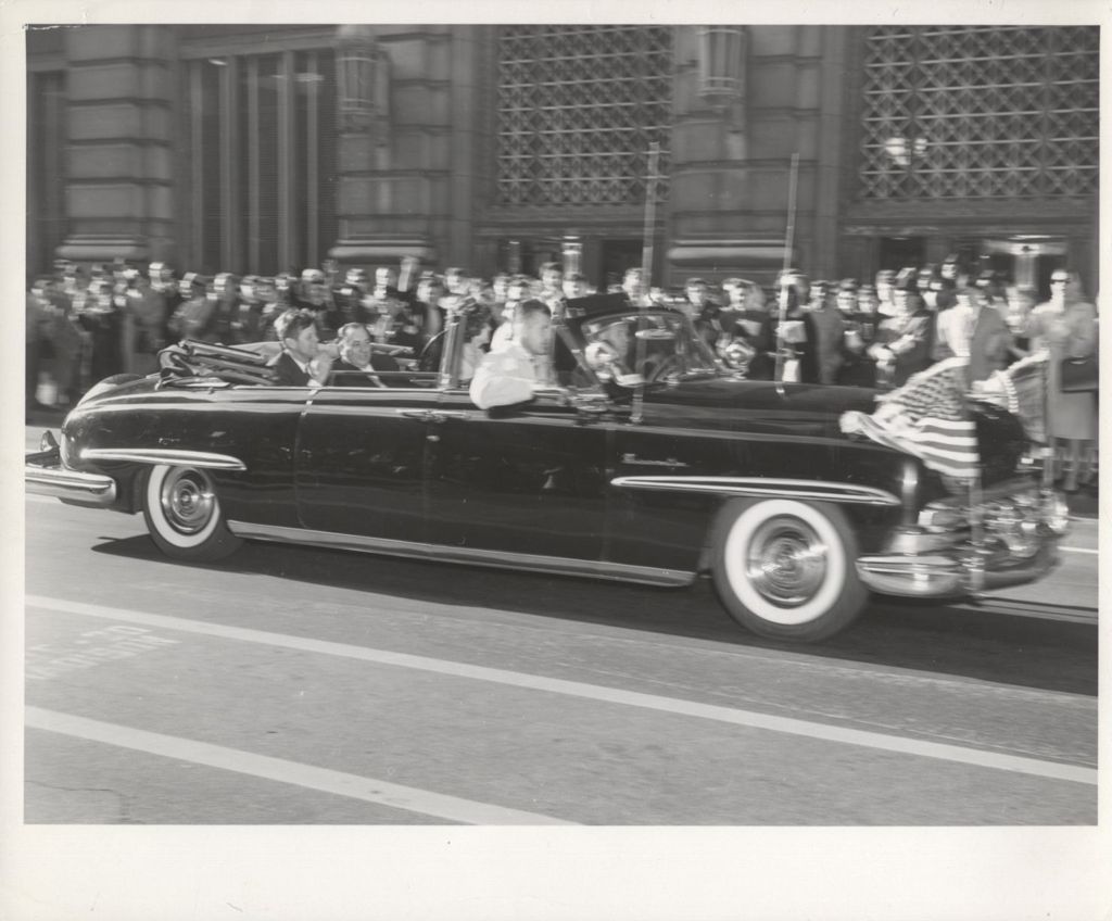 Miniature of President Kennedy rides in a motorcade during 1961 Chicago visit