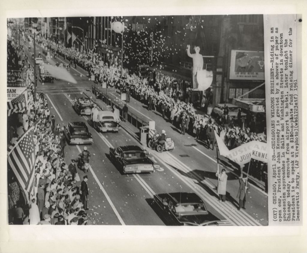 Miniature of President Kennedy rides in a motorcade during 1961 Chicago visit