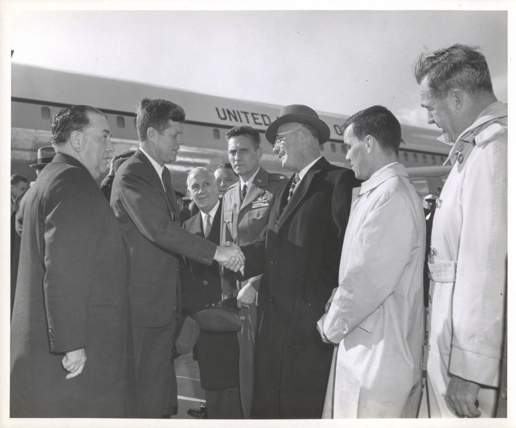 Miniature of President John F. Kennedy shaking hands with Chicago dignitaries