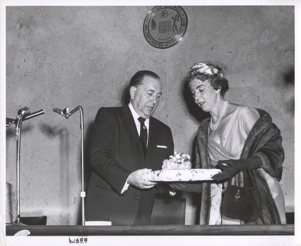 Richard J. Daley and Queen Ingrid of Denmark exchanging a gift-wrapped package