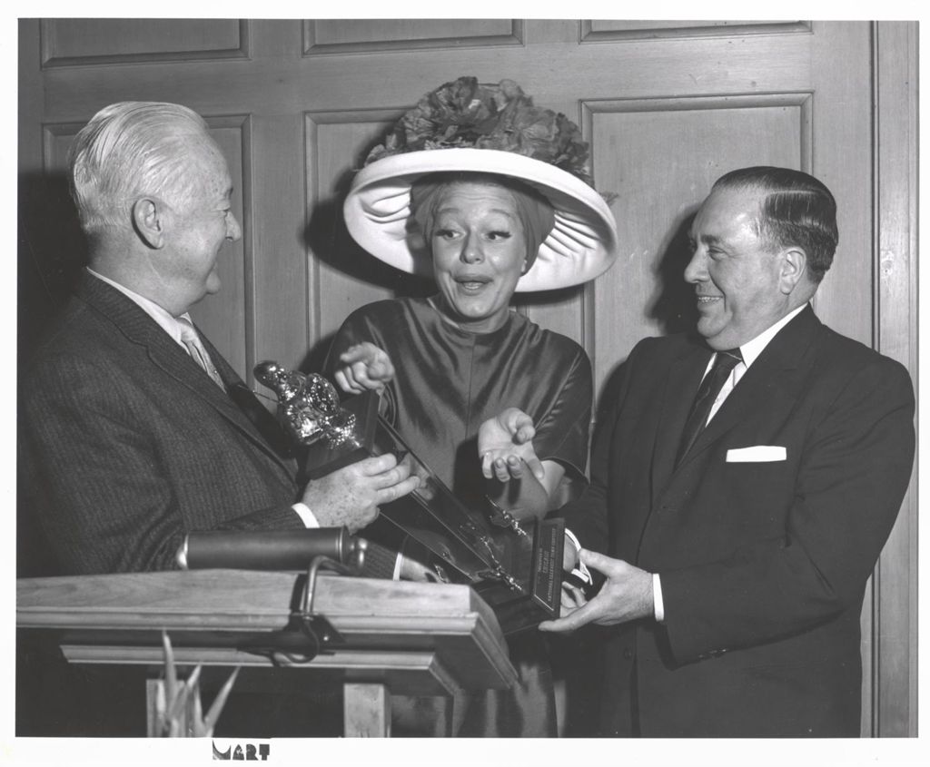 Carol Channing presenting Mayor Richard J. Daley with a trophy
