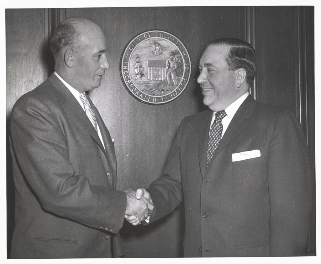 Richard J. Daley shaking hands with Bob Quinn