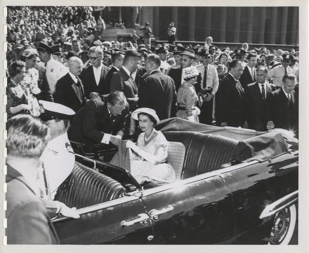 Queen Elizabeth II and Prince Philip in an open top car