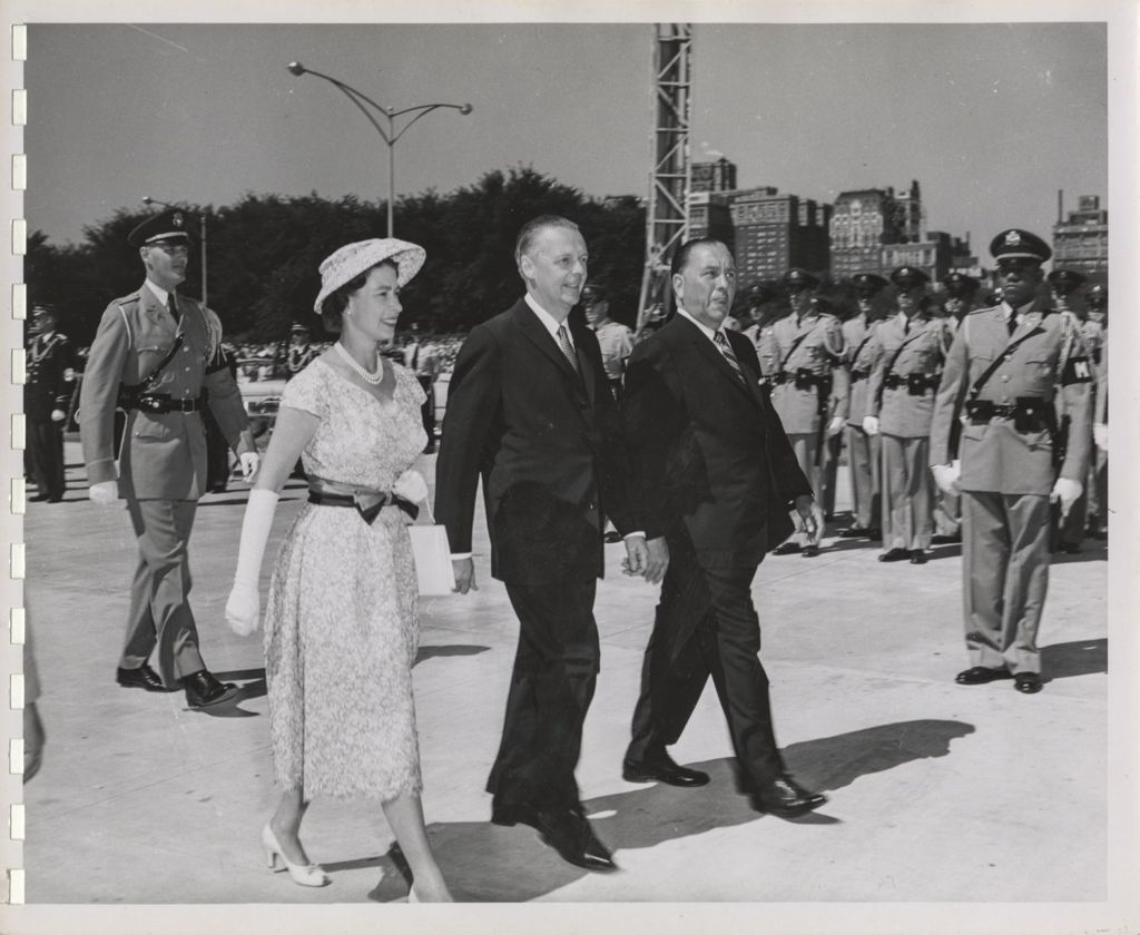 Queen Elizabeth II walks with William Stratton and Richard J. Daley