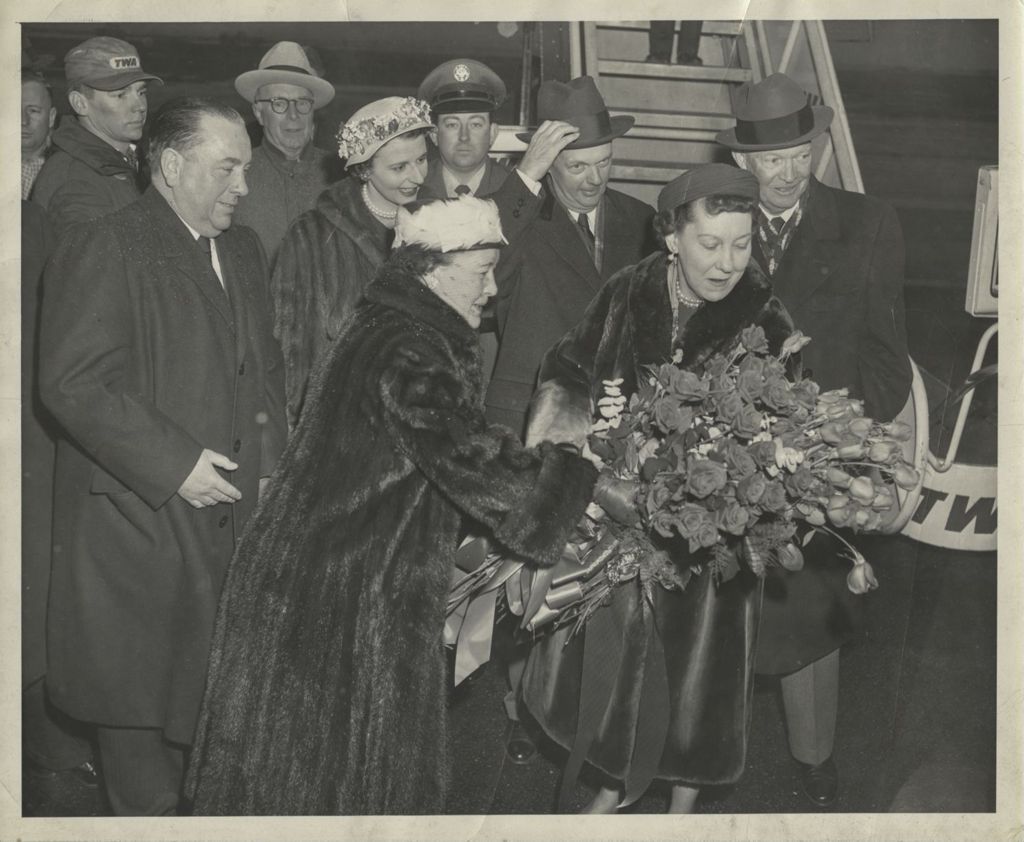 Miniature of Eleanor Daley presents flowers to Mamie Eisenhower