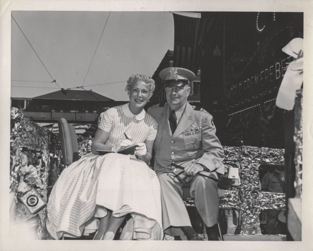 Betty Hutton riding on a parade float