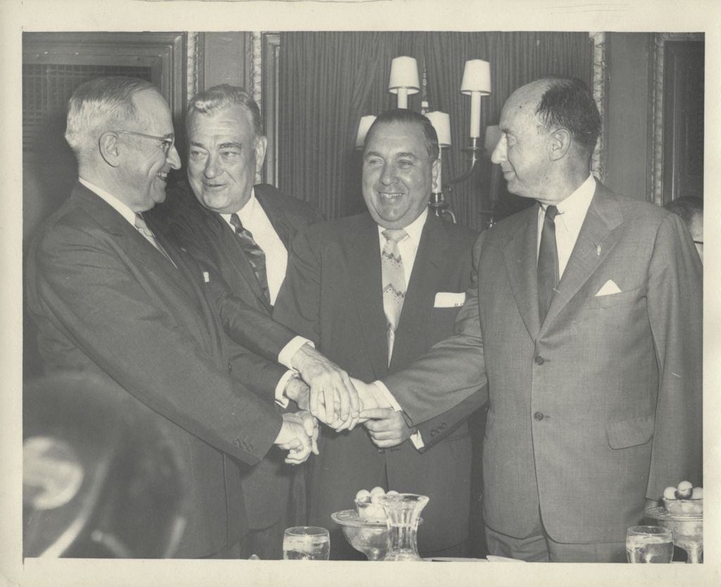Group handshake with Harry S. Truman