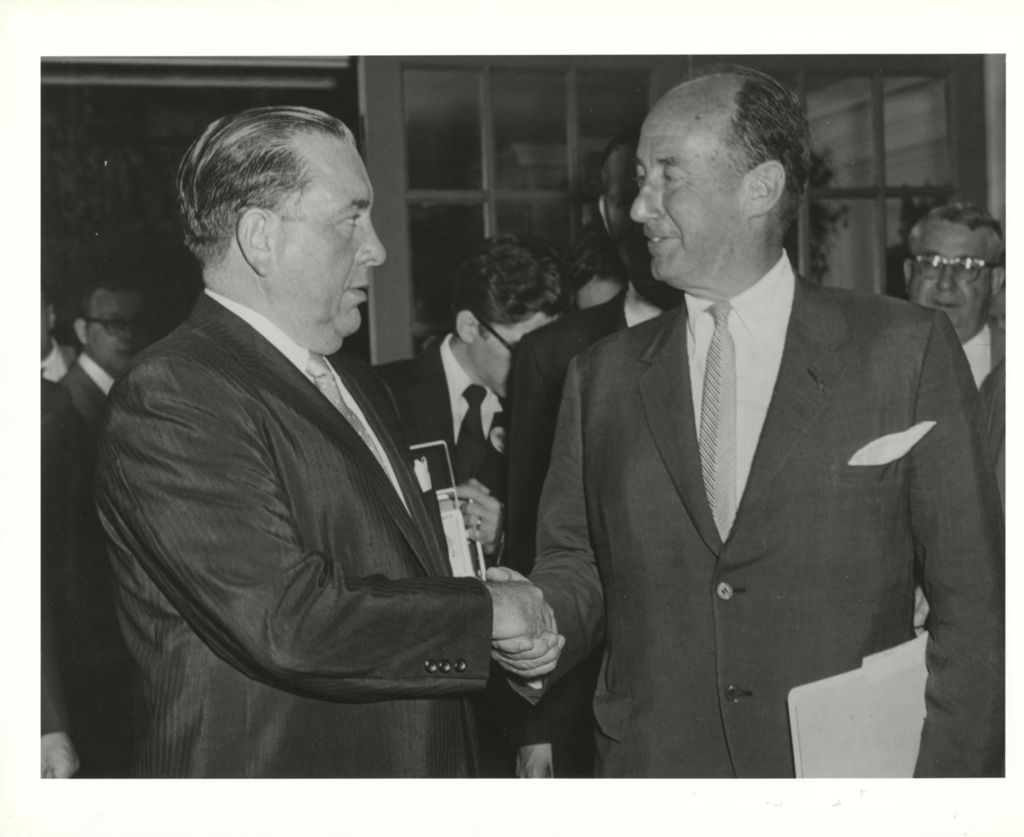 Mayor Richard J. Daley shaking hands with Adlai Stevenson