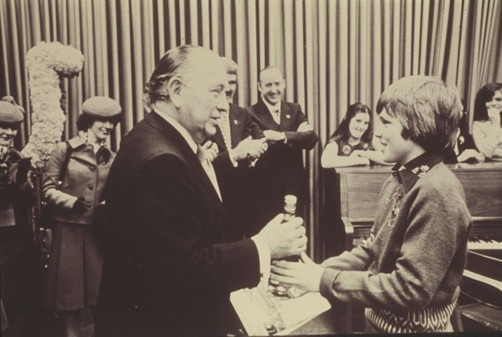 Miniature of Richard J. Daley accepts gift from a young performer