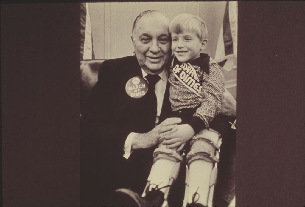 Richard J. Daley with boy wearing March of Dimes sash