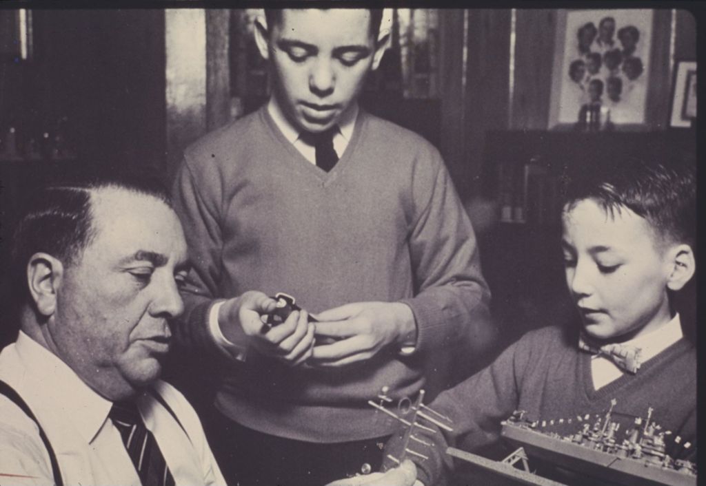 Richard J. Daley helps William and Michael Daley build a model ship