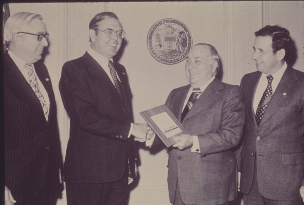 Miniature of Richard J. Daley accepts a plaque