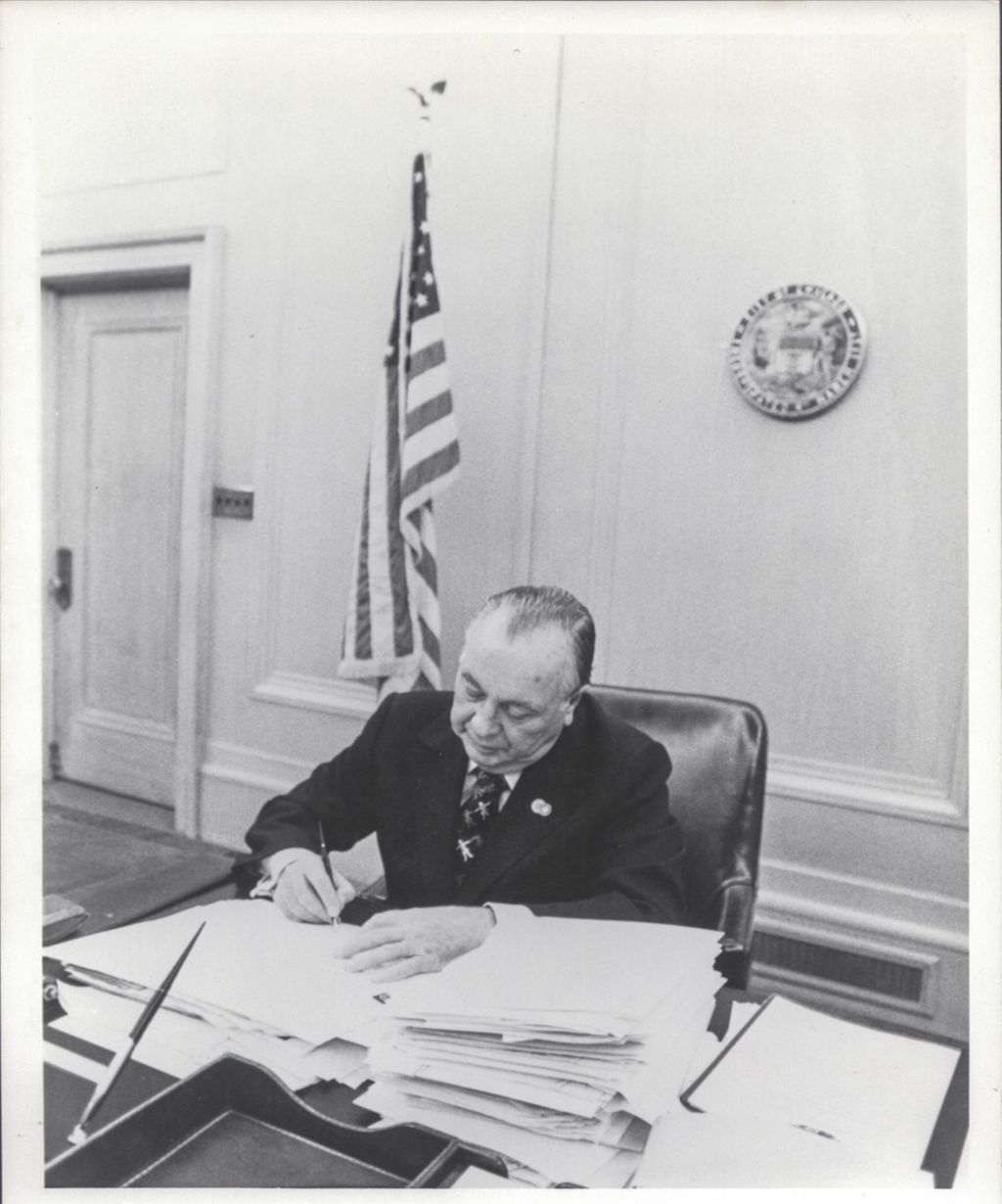 Miniature of Richard J. Daley working at his desk