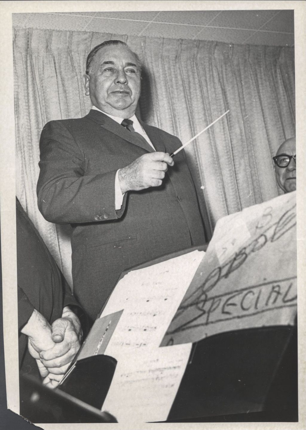 Richard J. Daley with a conductor's baton