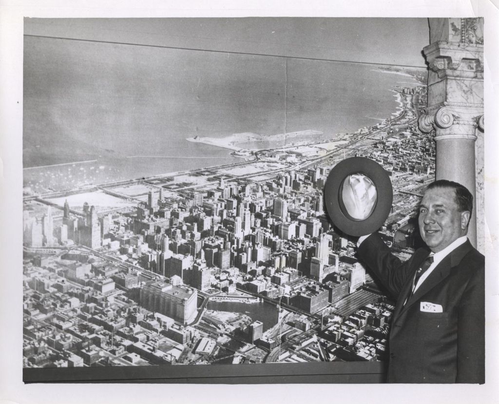 Richard J. Daley in front of photograph of City of Chicago