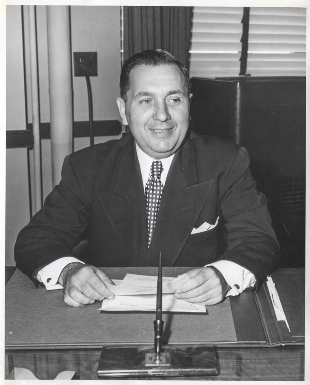 Miniature of Richard J. Daley, Director of Revenue, at a desk