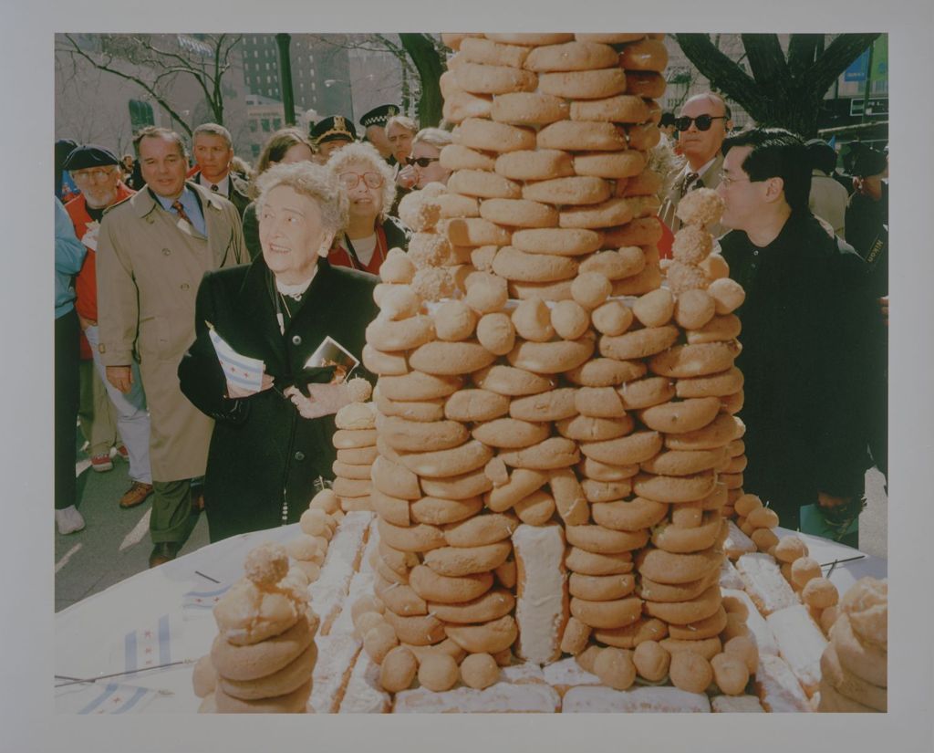 Eleanor Daley next to a tower of doughnuts on her 93rd birthday