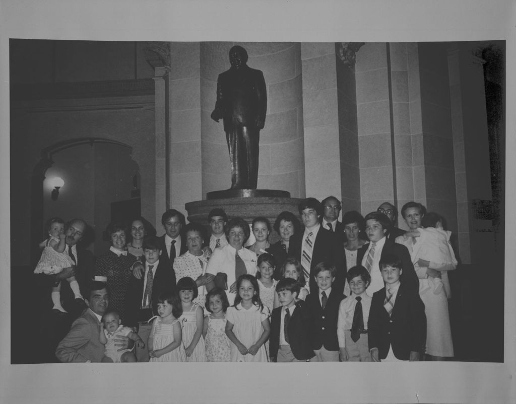 Daley family in front of Richard J. Daley statue in the Illinois State Capitol