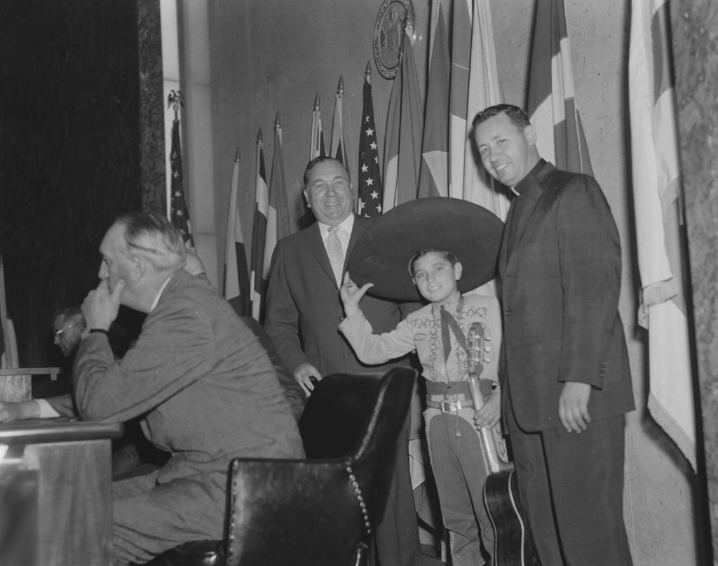Richard J. Daley with boy and priest promoting Pan American Games