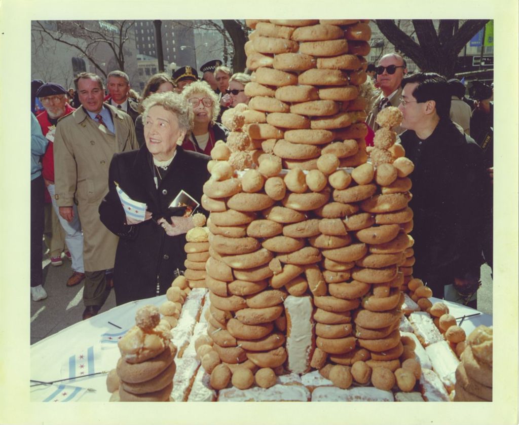 Eleanor Daley next to a tower of doughnuts on her 93rd birthday