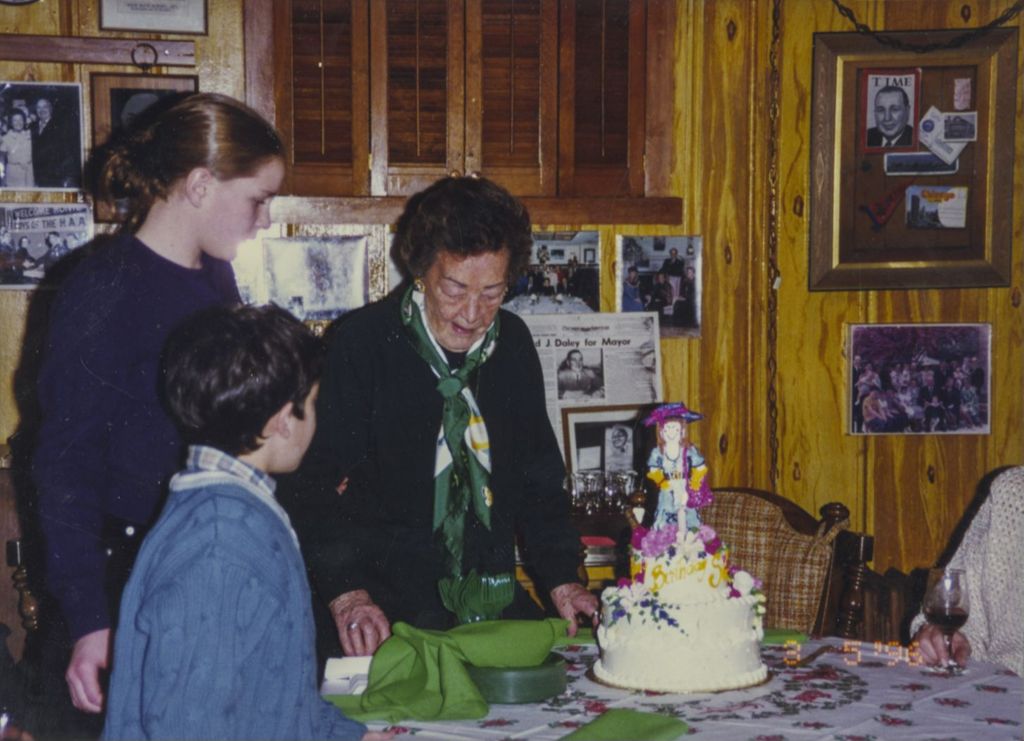 Eleanor Daley standing by her birthday cake