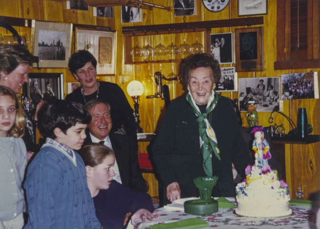 Eleanor Daley standing by her birthday cake