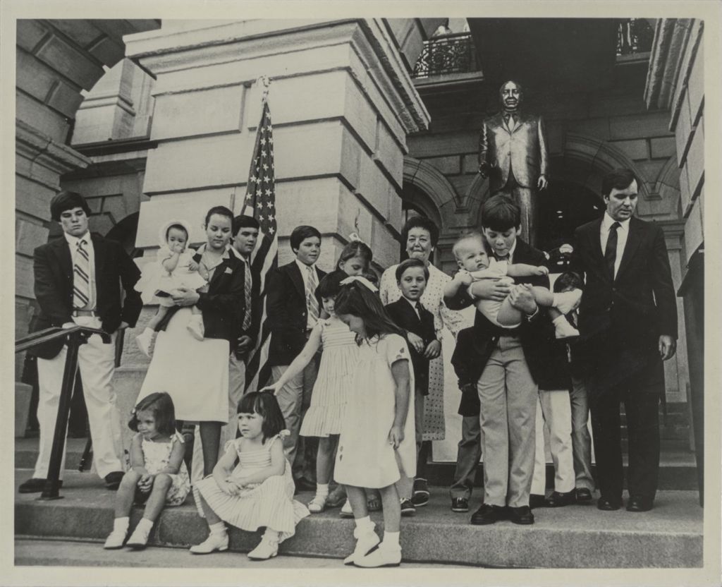 Miniature of Daley family members gathered by the Richard J. Daley statue