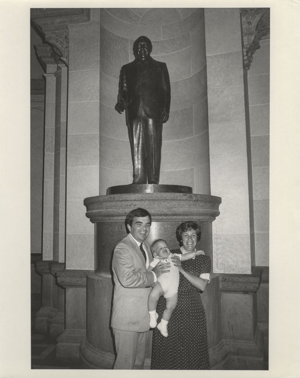 Miniature of John, Mary Lou, and John Daley, Jr., in front of the Richard J. Daley statue