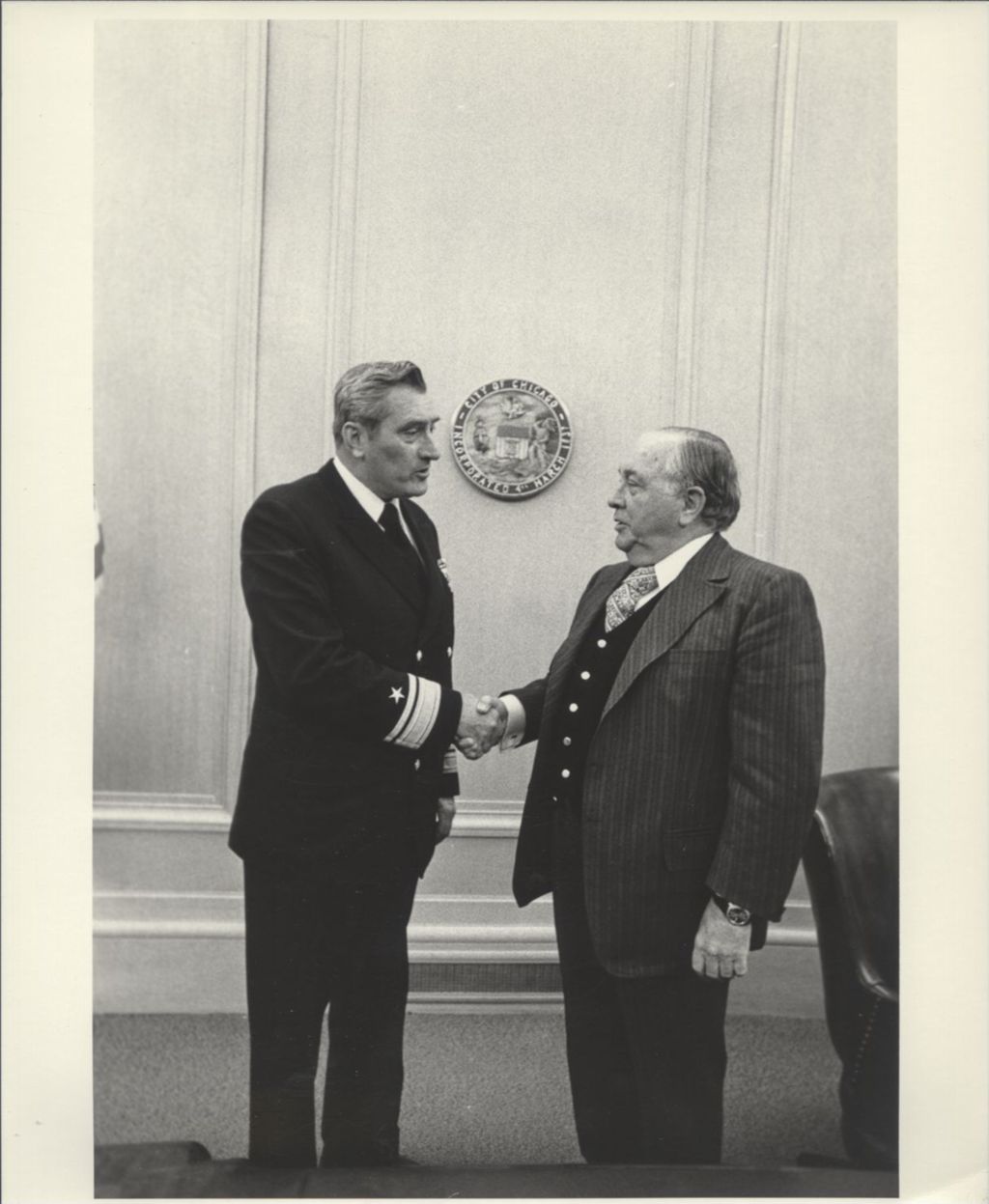 Miniature of Admiral Albert M. Sackett (Great Lakes) shaking hands with Richard J. Daley