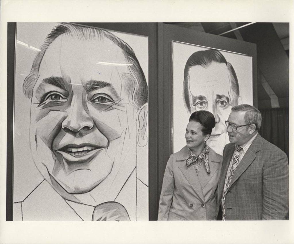 Miniature of Couple looking at a drawing of Richard J. Daley